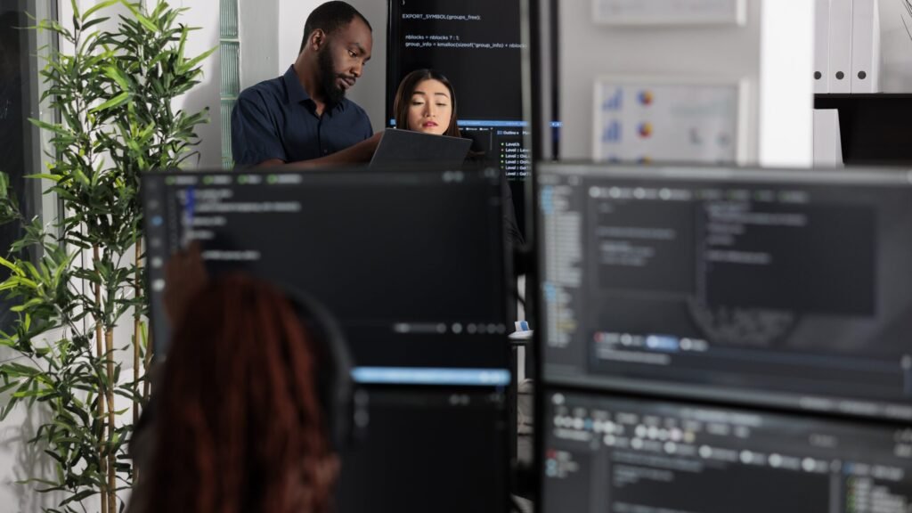 team-of-app-developers-looking-at-coding-algorithm-2023-11-27-04-53-40-utc (1)-min